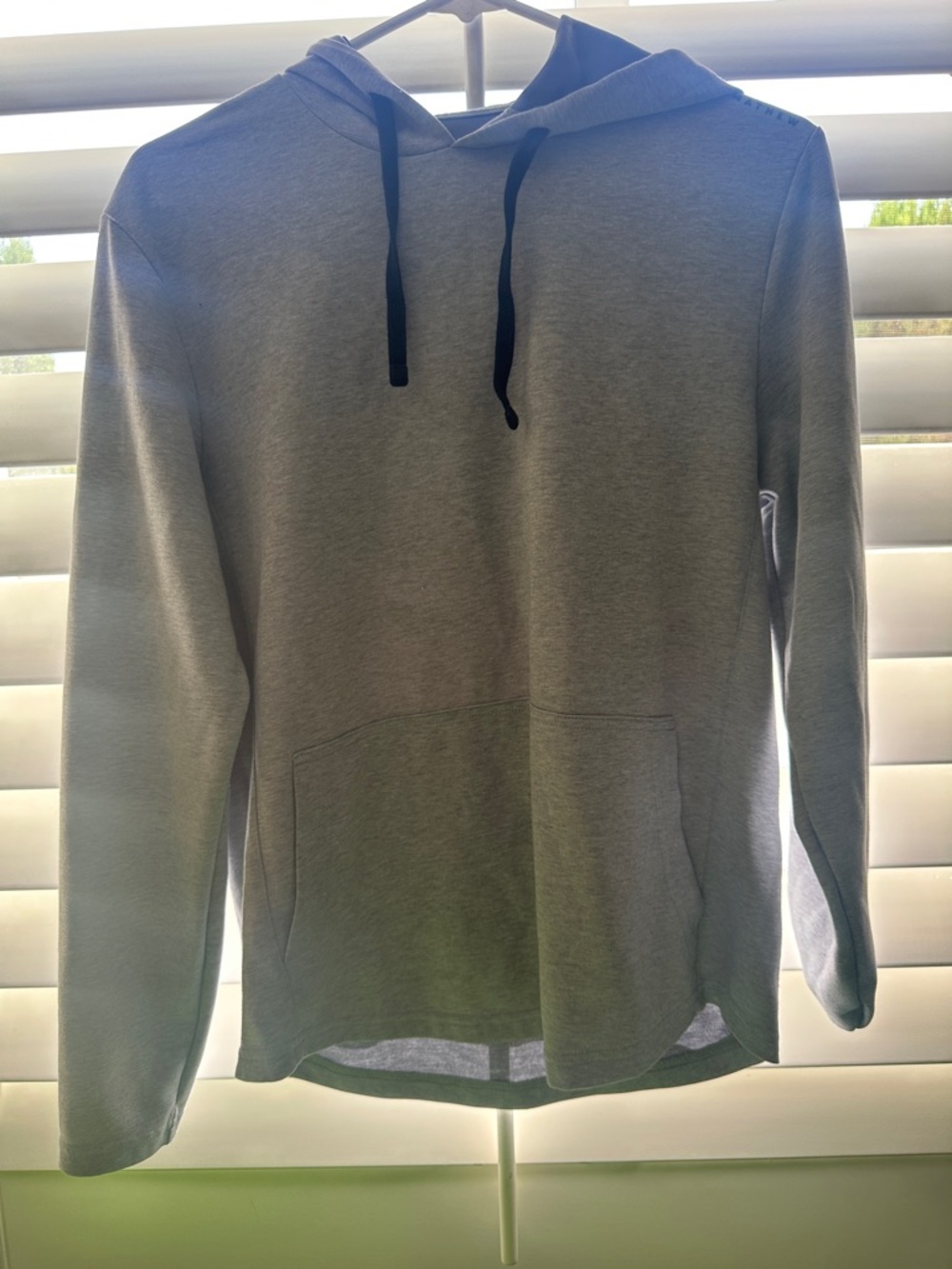 Travis Mathew Men's Light it Gray Pullover Hoodie with Black Drawstrings